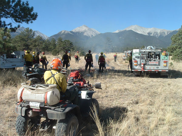 Federal, state and local firefighters prepare to ignite the Three Mile Prescribed Fire on U.S. Forest Service land next to the Mesa Antero Subdivision in October, 2007.